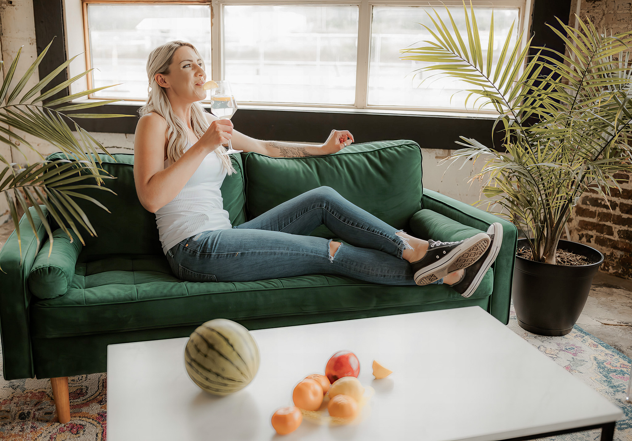 Health coach sitting on couch thinking about career change